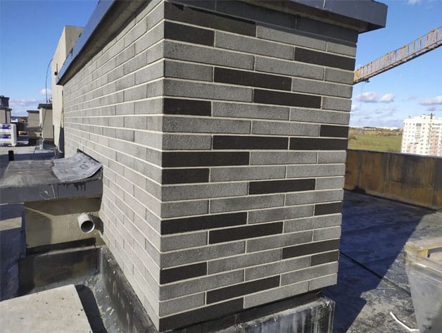 наружная отделка дома фасадными панелями из натурального камня